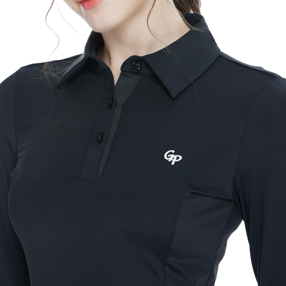 Black long-sleeved top with rhinestone embellishments and a turn-down collar.