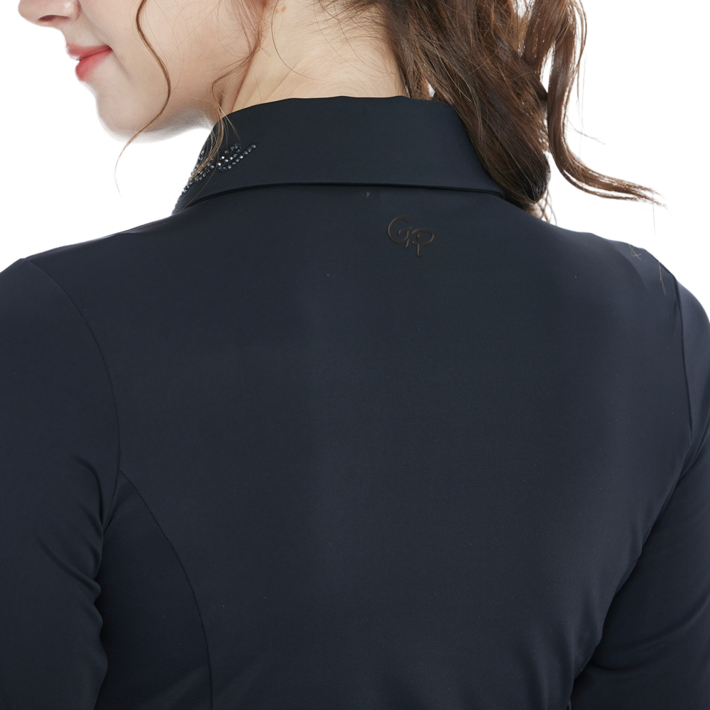 Black long-sleeved top with rhinestone embellishments and a turn-down collar.